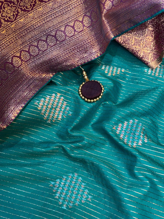 Saanvi Teal Blue Banarasi Silk Saree with Dual Zari Minakari Weaving & Contrast Pallu